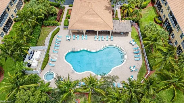 a view of a yard with potted plants