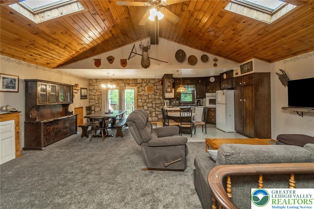 9223 North Loop Road Slatington, PA 18080 - Photo 28 of 60 a living room with furniture and a flat screen tv