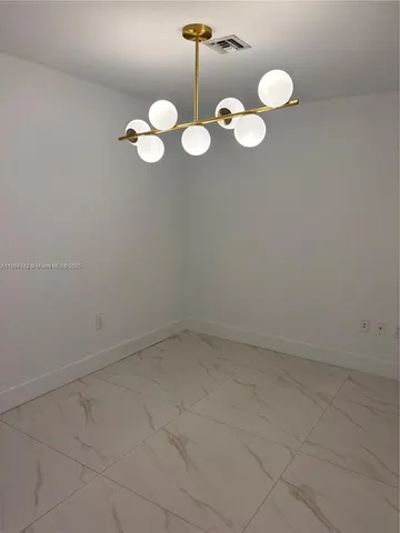 a view of a room with a fan