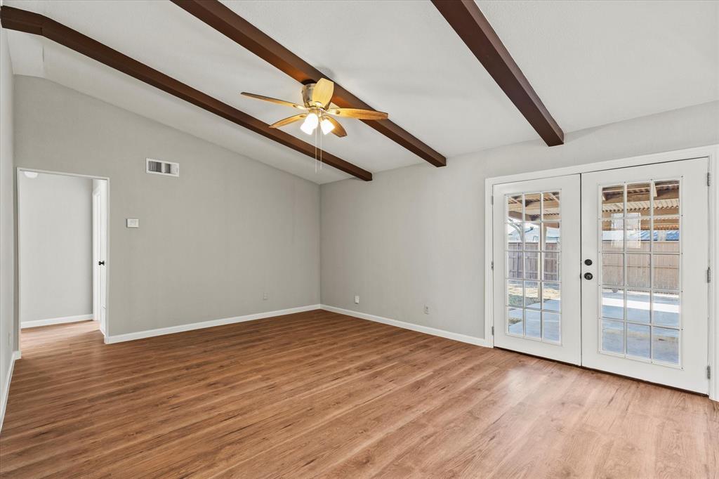 900 Wandering Way Drive Allen, TX 75002 - Photo 11 of 35 a view of an empty room with wooden floor