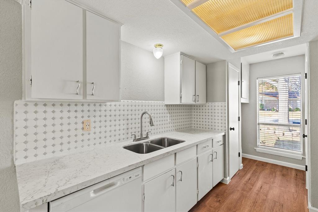 900 Wandering Way Drive Allen, TX 75002 - Photo 17 of 35 a kitchen with a sink and cabinets