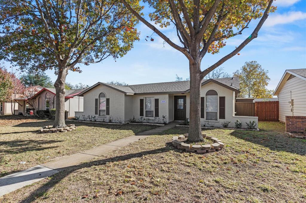 900 Wandering Way Drive Allen, TX 75002 - Photo 3 of 35 a front view of a house with garden