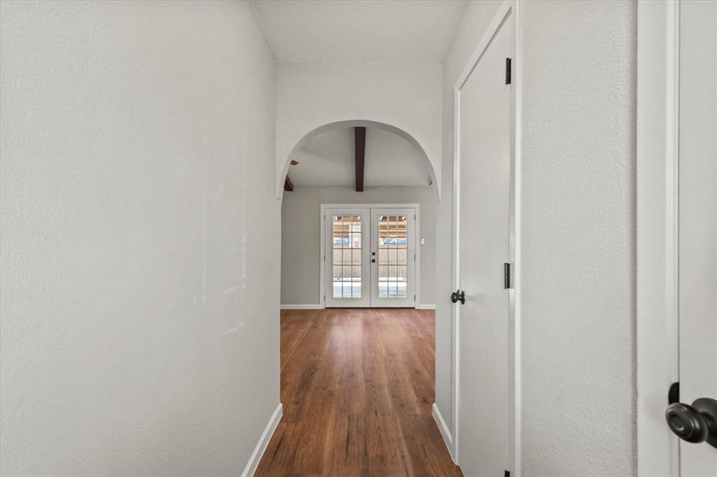 900 Wandering Way Drive Allen, TX 75002 - Photo 6 of 35 a view of a hallway with wooden floor and a window