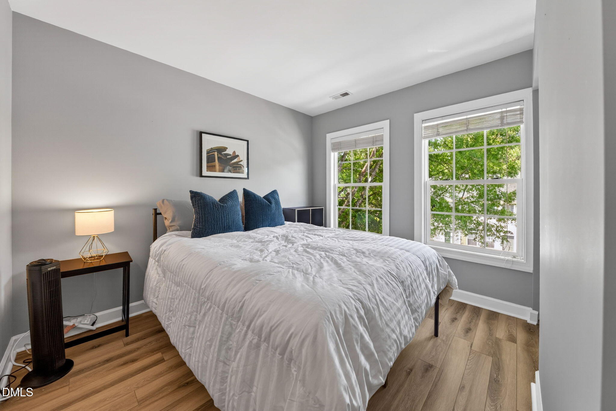 5500 Vista View Court Raleigh, NC 27612 - Photo 30 of 38 a bedroom with a bed and wooden floor