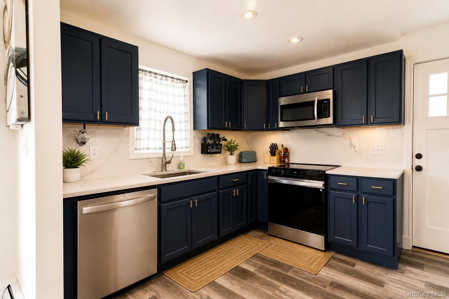33 Horton Road Bloomingburg, NY 12721 - Photo 20 of 28 a kitchen with stainless steel appliances granite countertop a sink and stove top oven