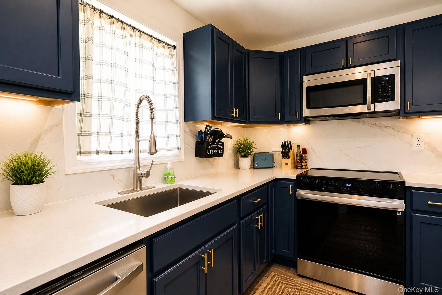 33 Horton Road Bloomingburg, NY 12721 - Photo 21 of 28 a kitchen with a sink and a microwave