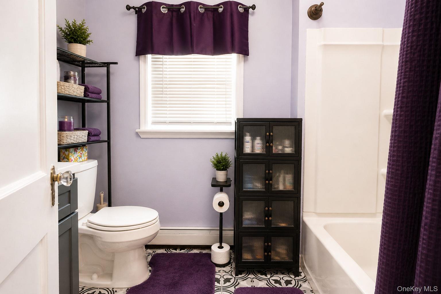 33 Horton Road Bloomingburg, NY 12721 - Photo 25 of 28 a bathroom with a toilet and a shower curtain