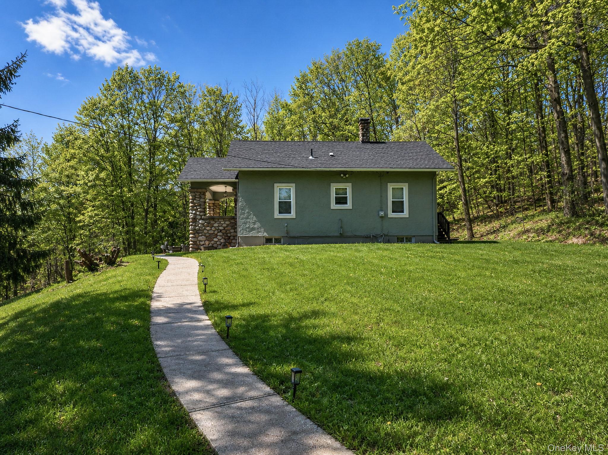 33 Horton Road Bloomingburg, NY 12721 - Photo 3 of 28 a front view of a house with yard