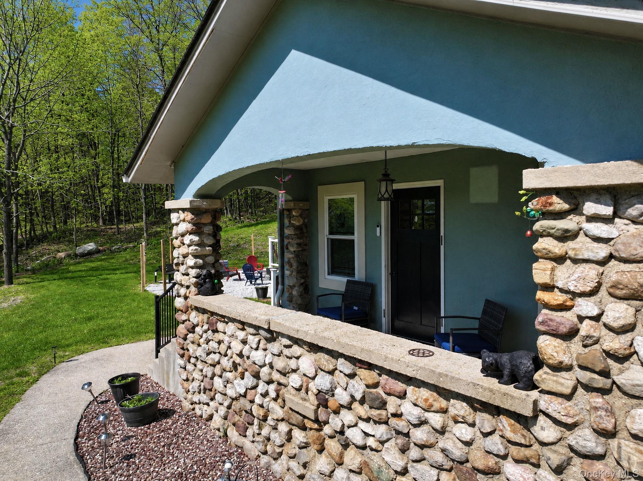 33 Horton Road Bloomingburg, NY 12721 - Photo 5 of 28 a front view of a house with a garden