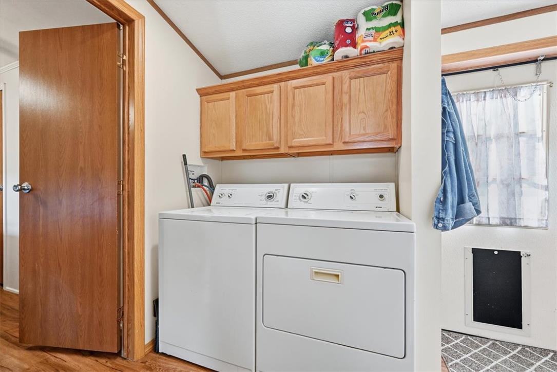 6129 Memorial Road Allentown, PA 18104 - Photo 32 of 46 Functional laundry area features overhead wood cabinetry and durable hard-surface flooring.
