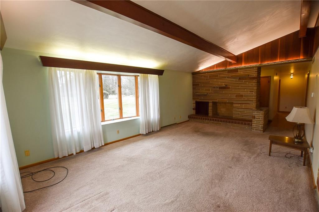 152 Oak Ridge Drive Butler, PA 16002 - Photo 2 of 12 a view of a livingroom with furniture and a window