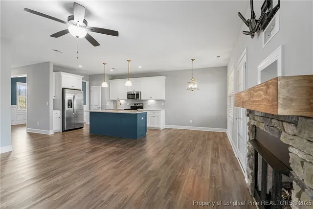 a view of kitchen with sink microwave and stove