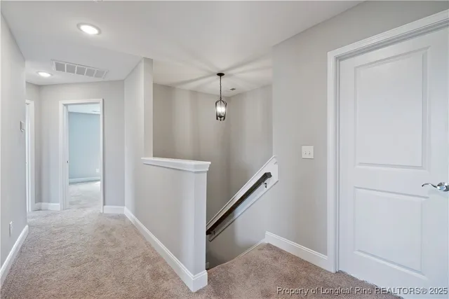 a view of a hallway with closet