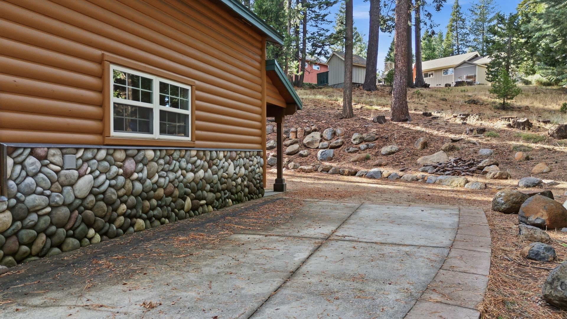 1017 Timber Ridge Road Lake Almanor, CA 96137 - Photo 44 of 45 a front view of a house with a yard