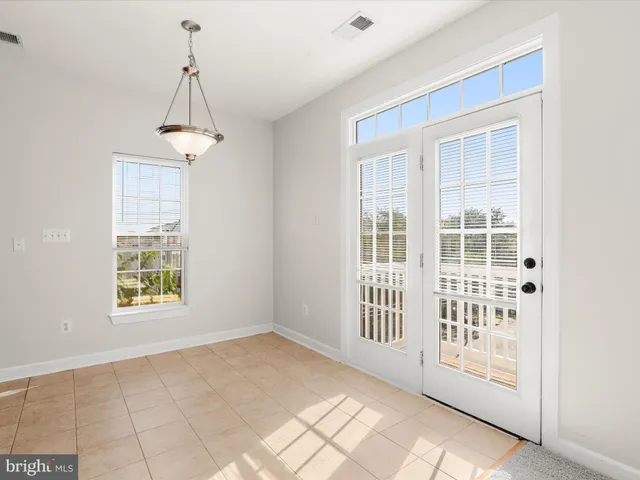a kitchen with granite countertop stainless steel appliances and cabinets
