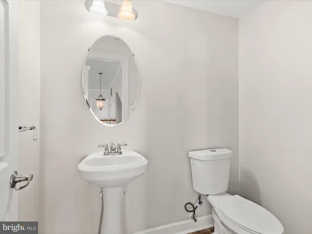 a view of an empty room with a fireplace