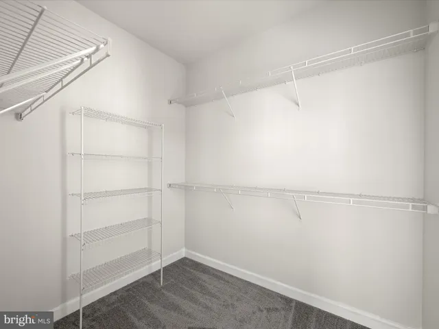 a bathroom with a tub a double vanity sink and a mirror