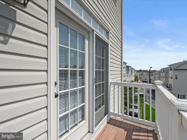 an empty room with closet and a chandelier fan