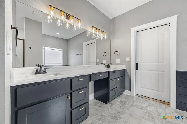 a bathroom with a bathtub and shower