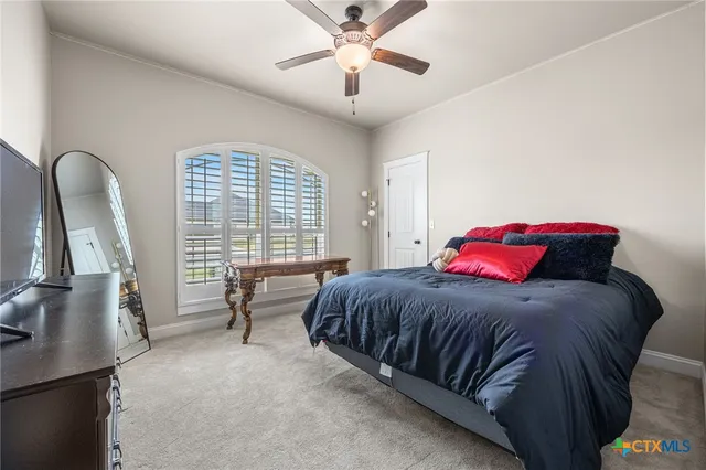a view of a refrigerator in kitchen and a window