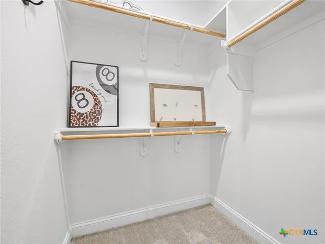 a view of washer and dryer with wooden floor