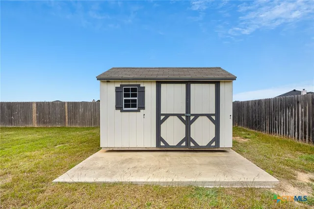 a view of a house with a garden
