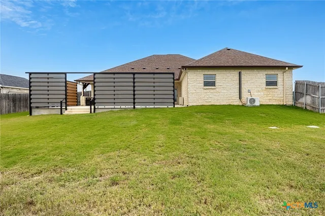a view of a yard in front of a house with a big yard