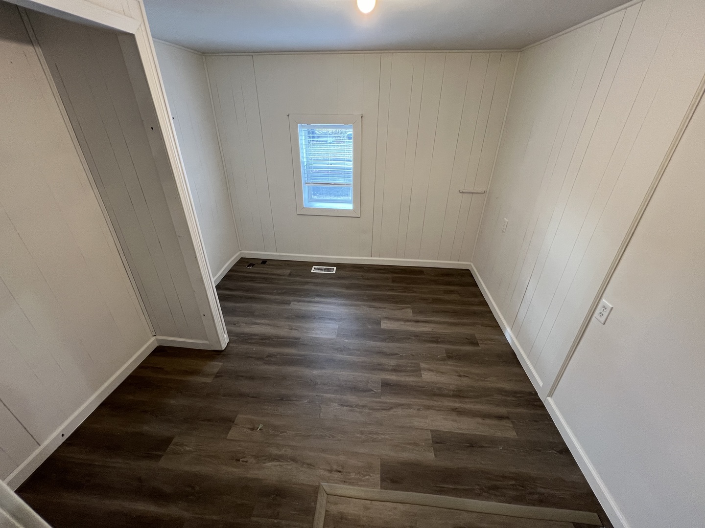1641 Jericho Road Aurora, IL 60506 - Photo 12 of 15 a view of an empty room with wooden floor and stairs