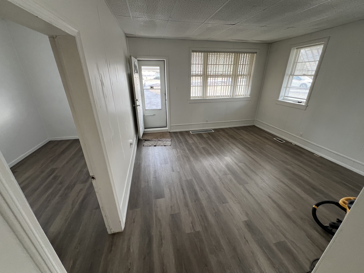 1641 Jericho Road Aurora, IL 60506 - Photo 7 of 15 a view of an empty room with wooden floor and a window