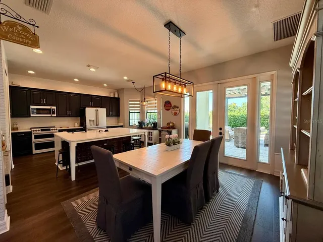 a kitchen with a refrigerator stove and microwave