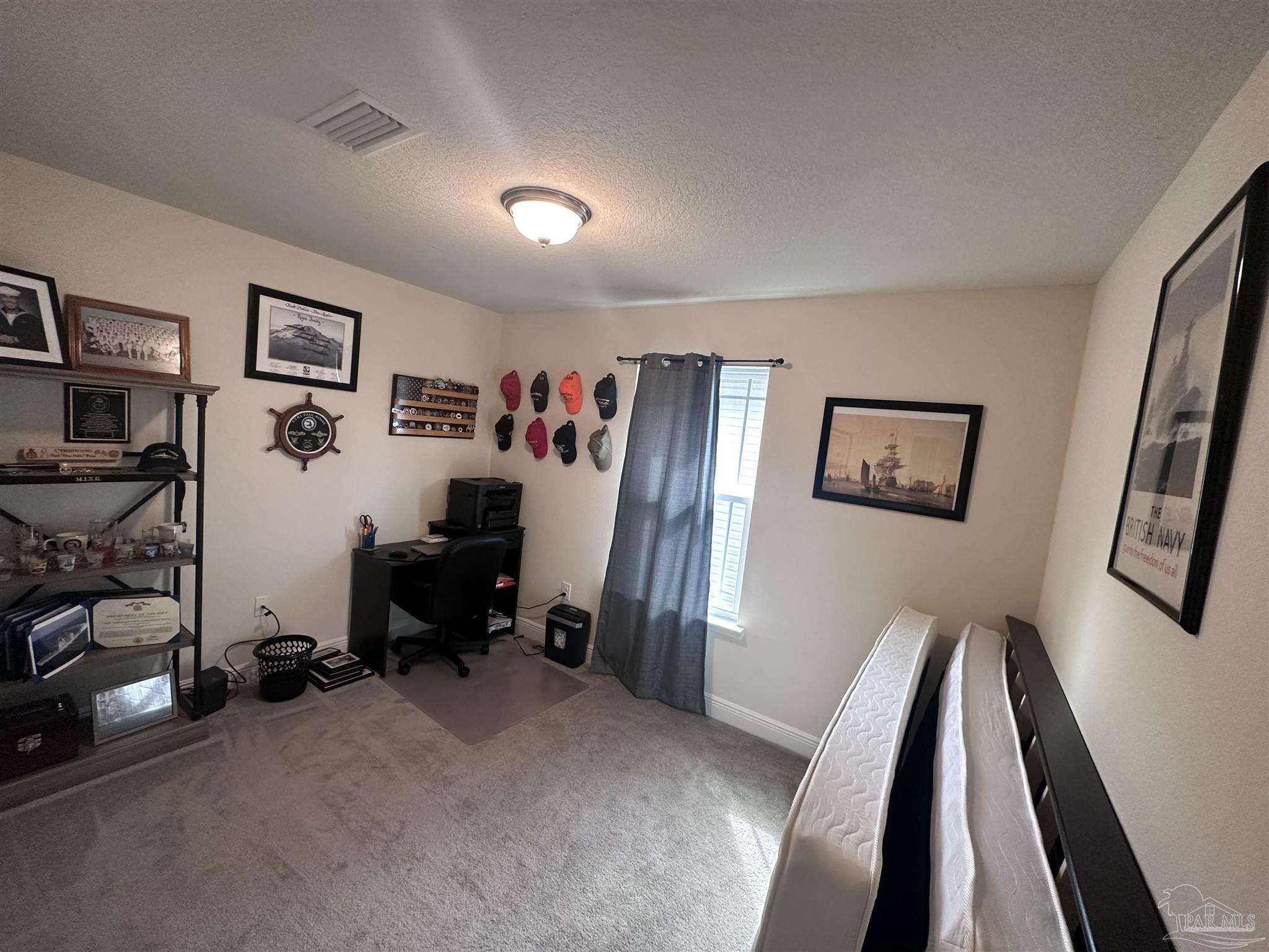 5217 Saufley Field Road Pensacola, FL 32526 - Photo 20 of 26 a view of a room with gym equipment