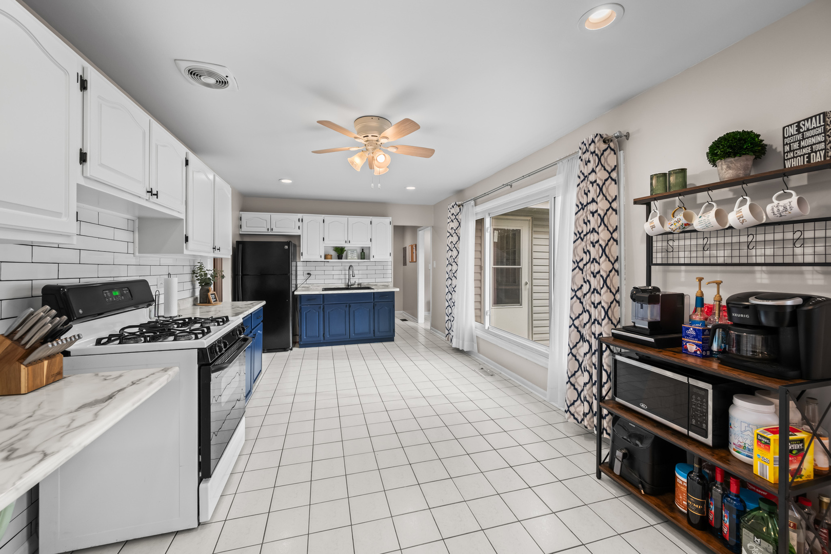 585 Amherst Lane Hoffman Estates, IL 60169 - Photo 11 of 25 a kitchen with stainless steel appliances granite countertop a stove and a refrigerator