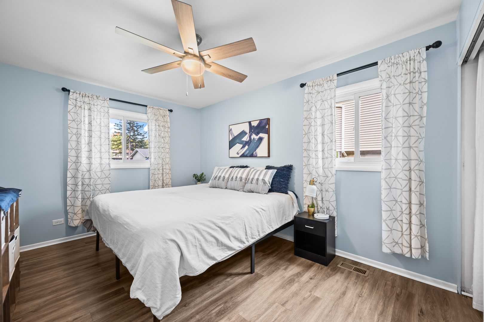 585 Amherst Lane Hoffman Estates, IL 60169 - Photo 13 of 25 a bed room with a bed and a window