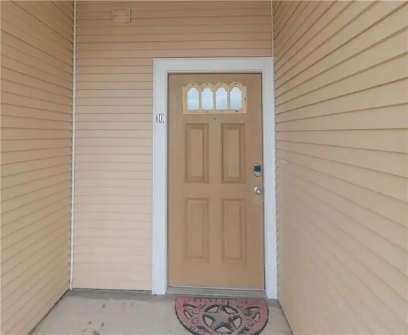 a view of a chair and table in the balcony