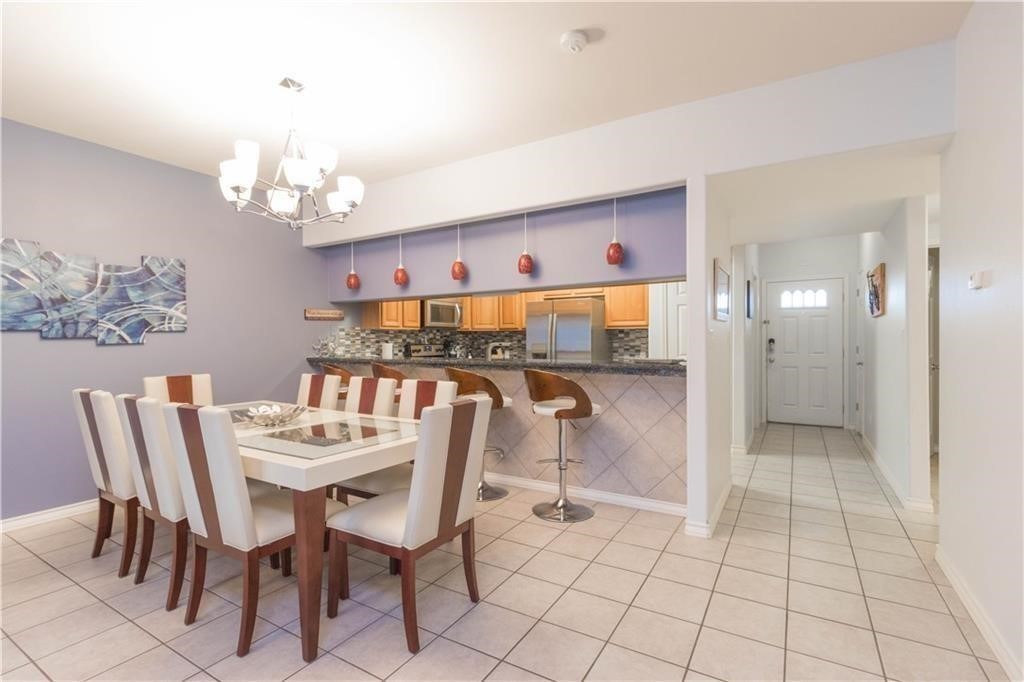 14427 Compass Street, Unit B10 Corpus Christi, TX 78418 - Photo 12 of 16 a view of a dining room with furniture