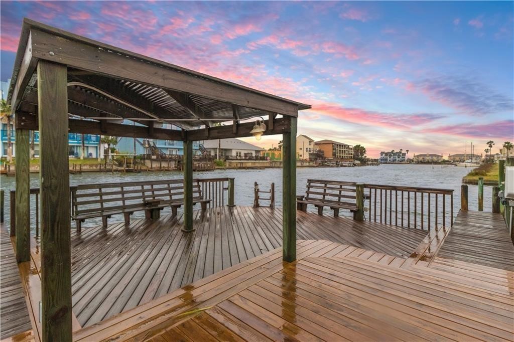 14427 Compass Street, Unit B10 Corpus Christi, TX 78418 - Photo 16 of 16 a view of a balcony with wooden floor and outdoor seating