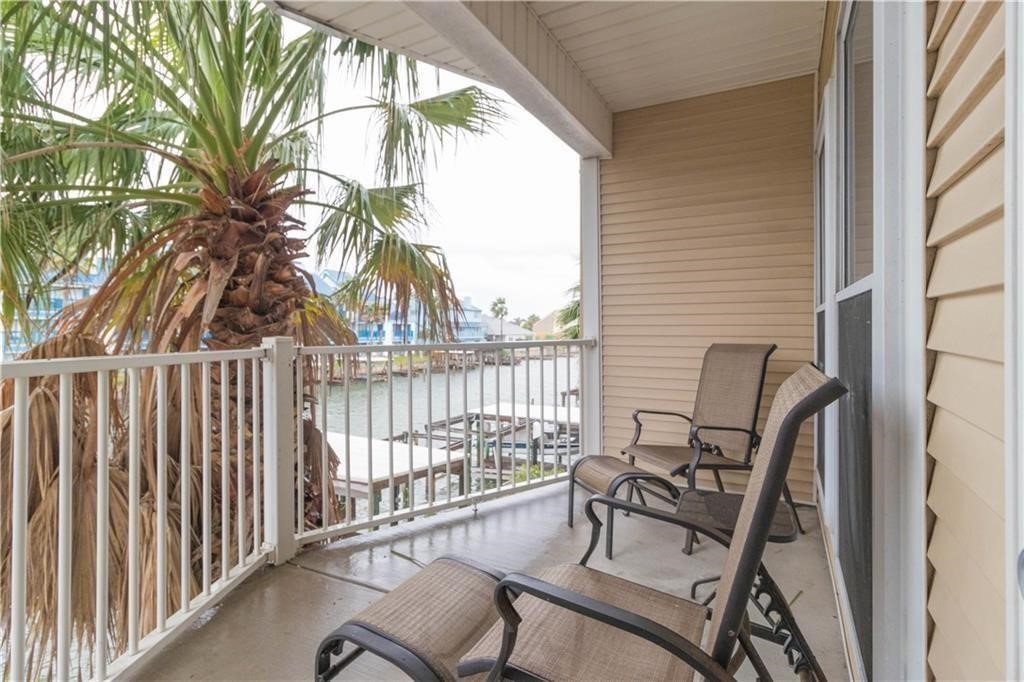 14427 Compass Street, Unit B10 Corpus Christi, TX 78418 - Photo 2 of 16 a view of a chair and table in the balcony