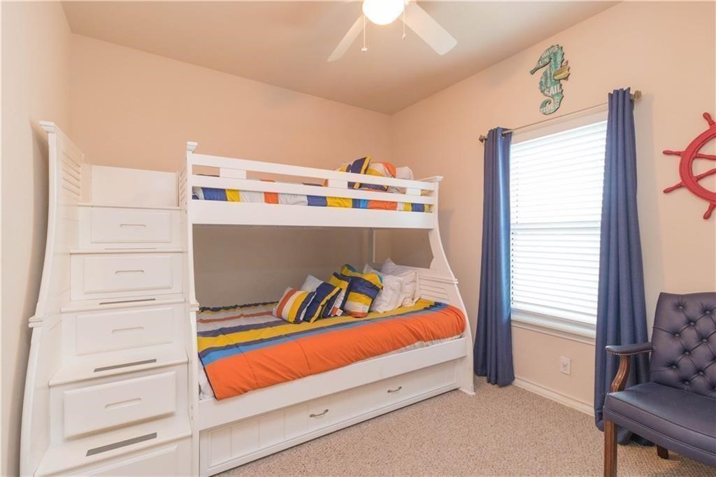 14427 Compass Street, Unit B10 Corpus Christi, TX 78418 - Photo 6 of 16 a bedroom with a bed and a window