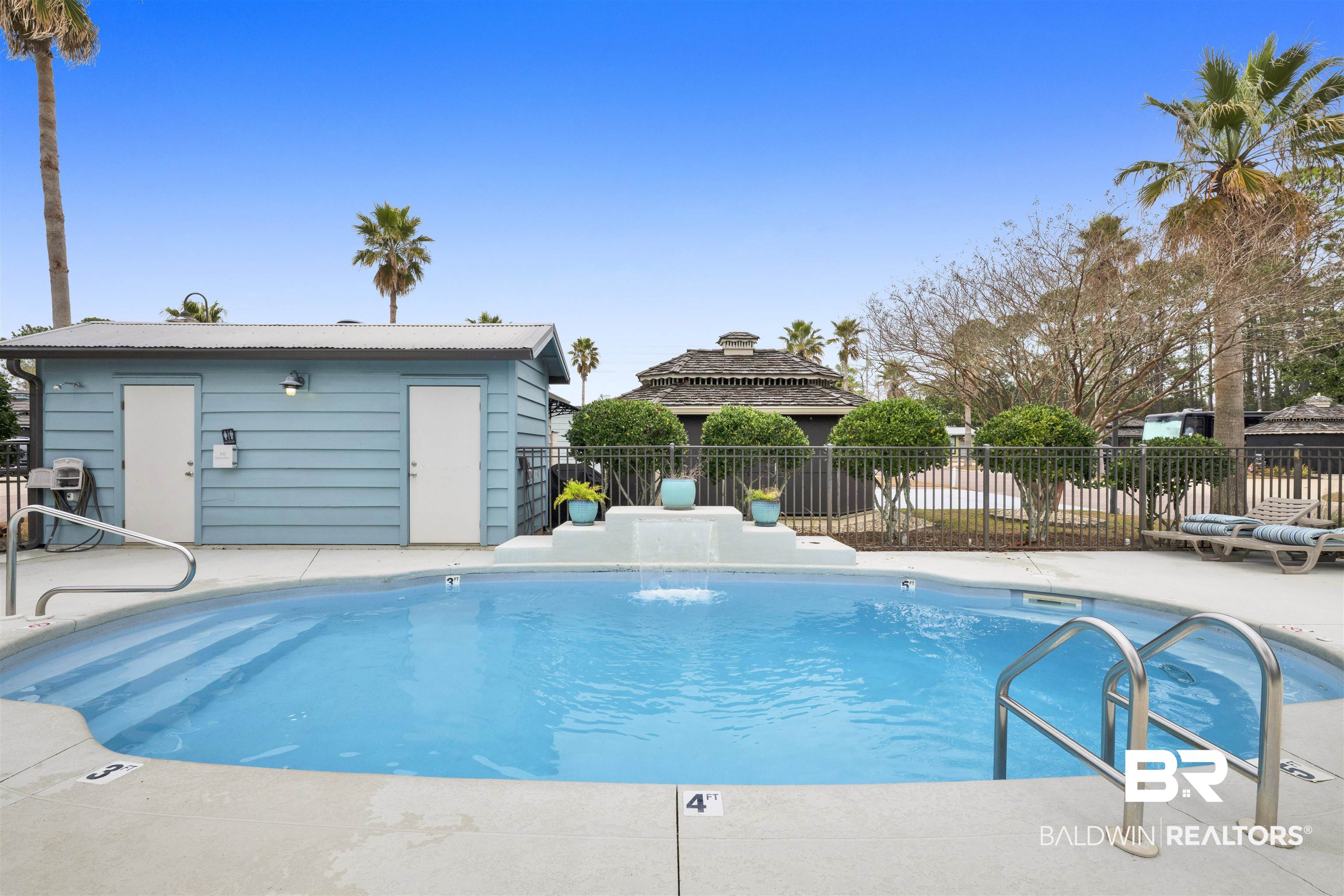 4650 Griffith Marina Road, Unit LOT 24 Orange Beach, AL 36561 - Photo 21 of 34 Community pool featuring a patio area