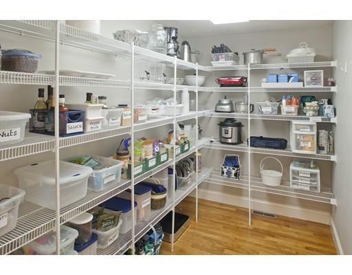 92 Forest Street Duxbury, MA 02332 - Photo 12 of 34 a shelf with books and knick knacks on it