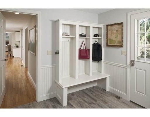 92 Forest Street Duxbury, MA 02332 - Photo 13 of 34 a view of a hallway with wooden floor and windows