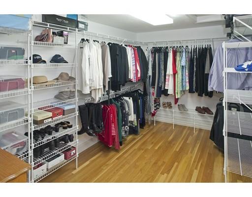 92 Forest Street Duxbury, MA 02332 - Photo 18 of 34 a view of walk in closet with clothes and shoes