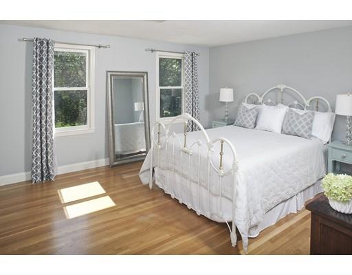 92 Forest Street Duxbury, MA 02332 - Photo 20 of 34 a living room with a bed furniture and windows