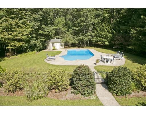92 Forest Street Duxbury, MA 02332 - Photo 32 of 34 a view of a swimming pool with a yard