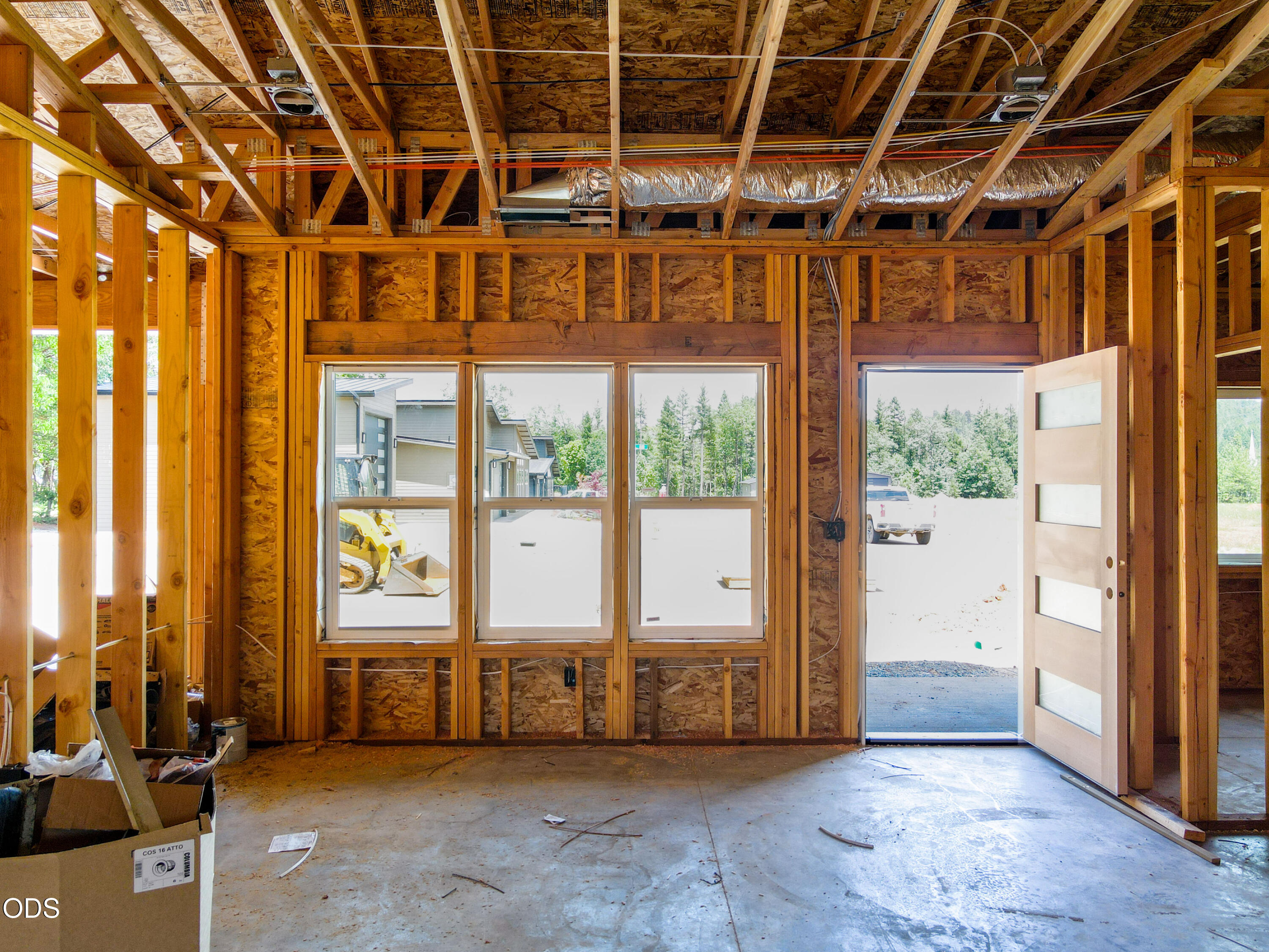 405 Cece Lane Cave Junction, OR 97523 - Photo 9 of 15 a view of an empty room with a sliding door