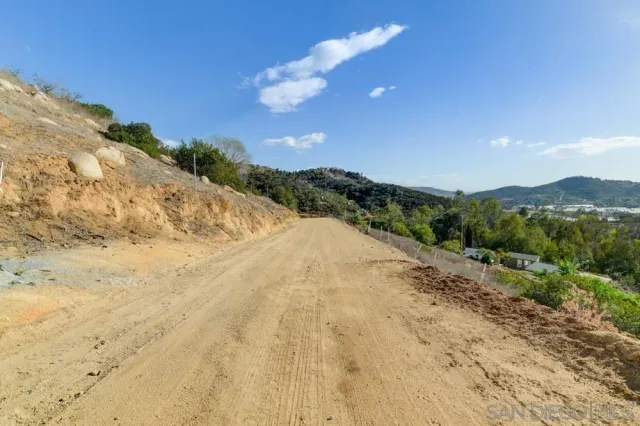 a view of a road with a yard