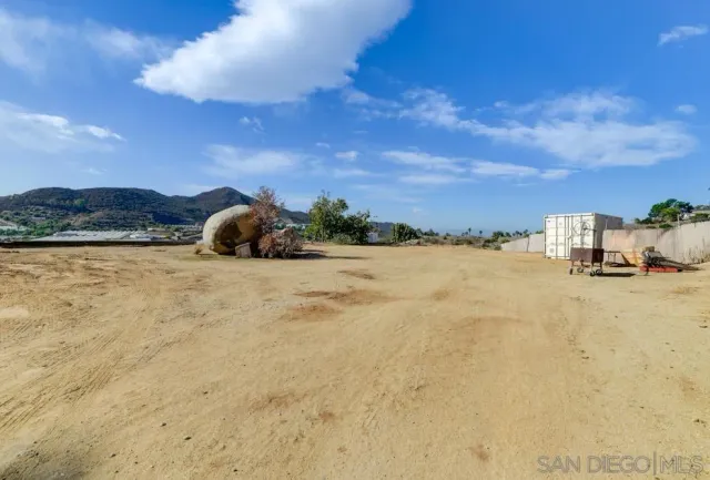 a view of a backyard of the house
