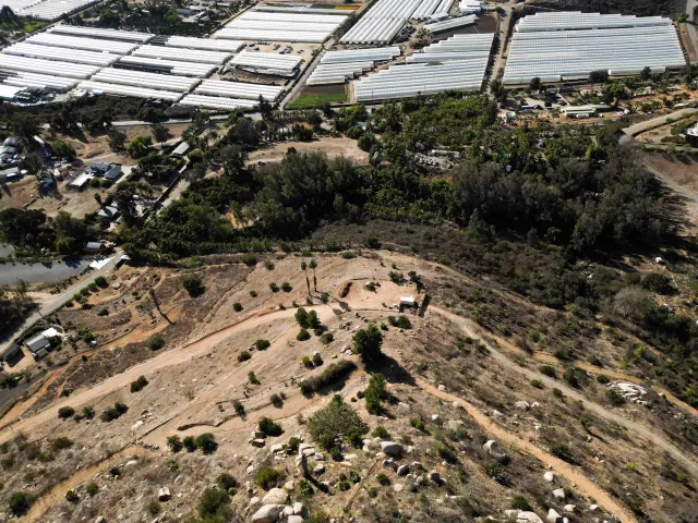 a view of a town with mountains in the background