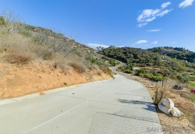 a view of a road with a yard