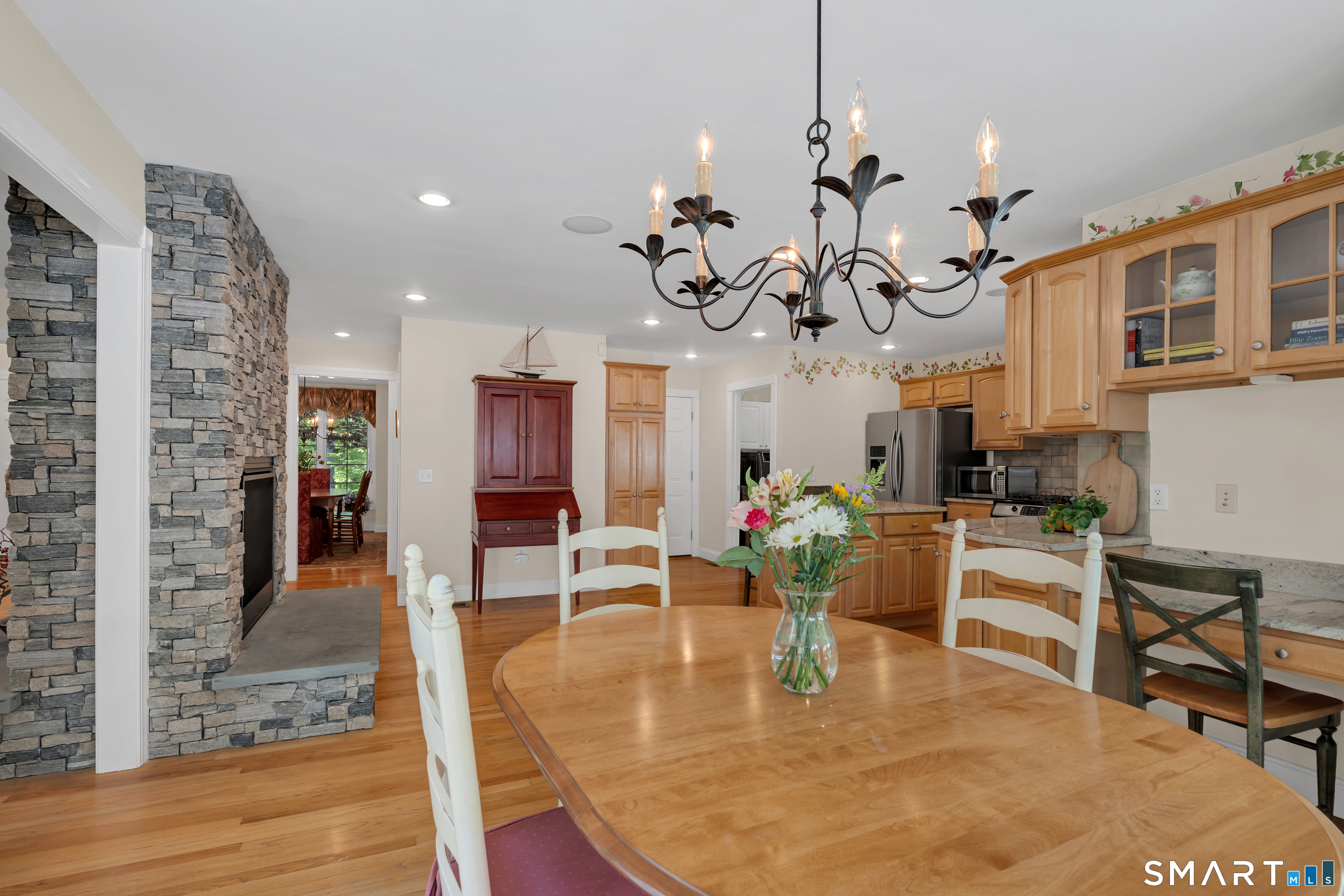 21 Stone Wall Road Salem, CT 06420 - Photo 13 of 38 a living room with fireplace furniture and a wooden floor